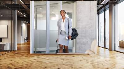 Black beautiful woman walking at airport Wall mural