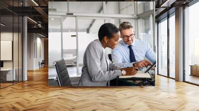 Business partners working on digital tablet in modern office Wall mural