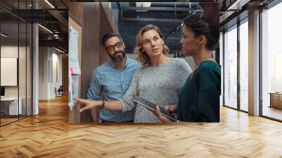 Business people discussing graphs Wall mural