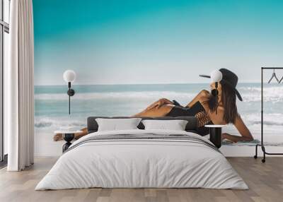 Fashion woman relax at beach Wall mural