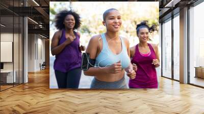 Group of natural curvy women jogging Wall mural