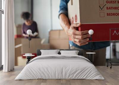 Hands holding cardboard box during relocation Wall mural