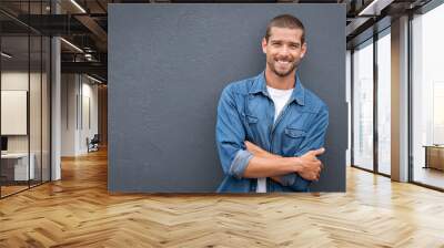 Handsome young man smiling Wall mural