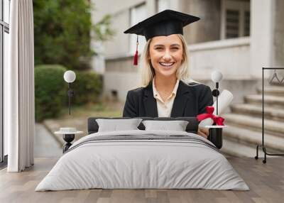 Happy graduate student wearing graduation cap Wall mural