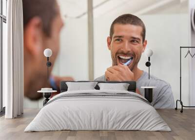 Happy man brushing teeth Wall mural