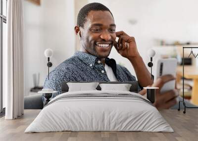 Happy mature man doing video call at home Wall mural