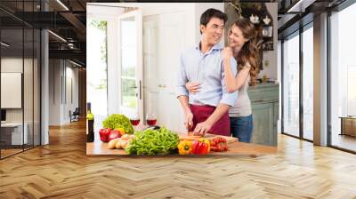 Happy Young Couple Working In Kitchen Wall mural