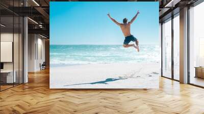 Jumping in joy for vacation Wall mural