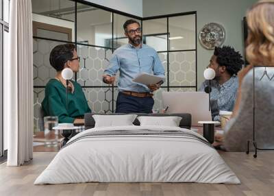 Man giving presentation in boardroom Wall mural