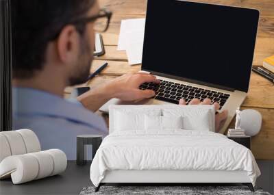 Man working on laptop Wall mural