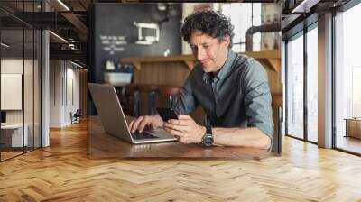 mature businessman working at cafe Wall mural