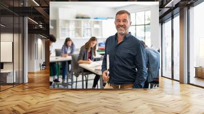 Mature man professor standing in class Wall mural