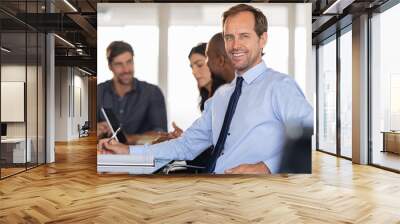 Mature successful businessman in meeting Wall mural