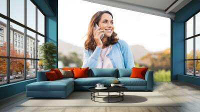 Mature woman talking on phone Wall mural