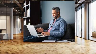 Mixed race businessman on video call in smart working Wall mural