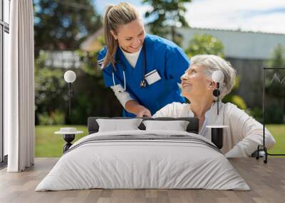 Nurse take care of senior patient Wall mural