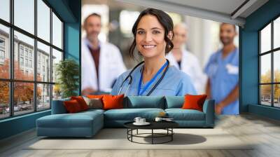 Portrait of friendly nurse smiling at hospital Wall mural