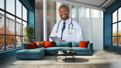 Portrait of happy african doctor at private clinic Wall mural