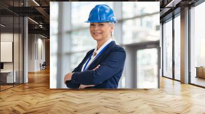 Portrait of mature architect with hardhat at construction site Wall mural