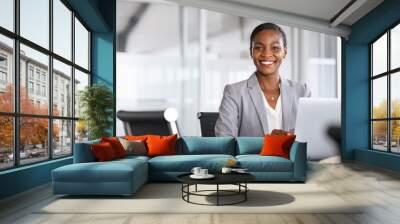 Portrait of smiling black businesswoman looking at camera Wall mural