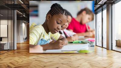 School girl writing in class Wall mural