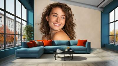 Smiling beauty woman with freckles looking away Wall mural