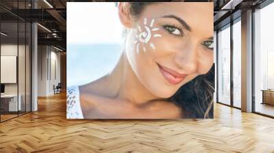 Smiling Girl With Sun Lotion Wall mural