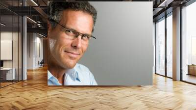 smiling mature man with glasses Wall mural