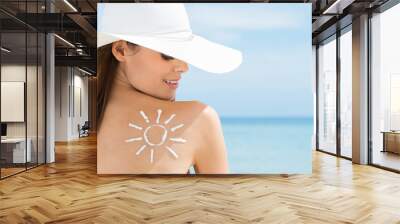 Sun Drawn On Woman's Shoulder With Sun Protection Cream Wall mural