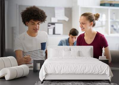 Teen students studying together at school Wall mural