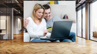 Young couple internet shopping Wall mural