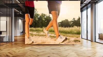 young couple jogging in park Wall mural