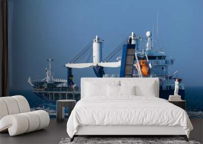 Multipurpose cargo vessel at sea. Wall mural