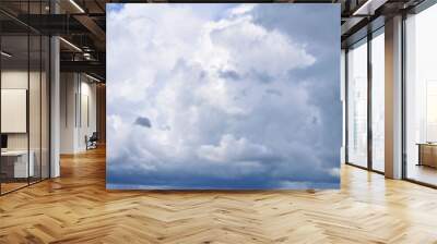 Clouds against the blue sky. Atmospheric phenomenon-vaporization, visible to the naked eye, panorama. Wall mural