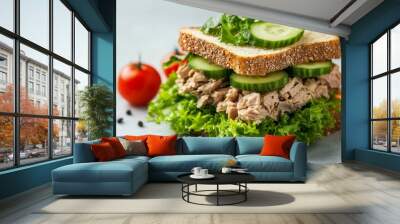 Delicious sandwich with tuna, lettuce leaves and cucumber on light grey table Wall mural