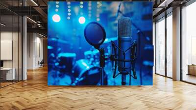 Professional microphone in a recording studio in blue light Wall mural