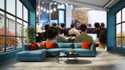 Audience Listens to Lecturer at a Conference Meeting Seminar Training. Group of People Hear Presenter Give Speech . Corporate Manager Speaker Gives Business Technology and Economic Forecast. Wall mural