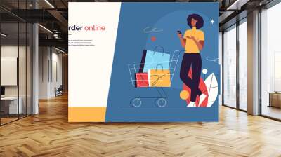 Vector illustration depicting a young woman with phone and shopping cart on the subject of sale, promotions, online shopping. Editable stroke Wall mural