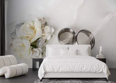  wedding rings - silver wedding rings on a white silk pillow Wall mural