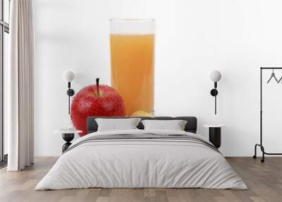 apple juice -  ​red apple with drops of water and a glass of naturally cloudy apple juice in front of white background Wall mural