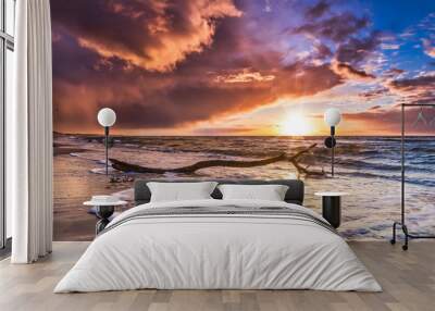 Beautiful cloud cover over the sea sunset at the beach - dramatic sunset on the baltic sea Wall mural