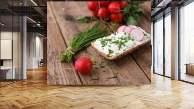 healthy breakfast - wholemeal roll with quark and fresh chive, radish  on a rustic wooden table  Wall mural