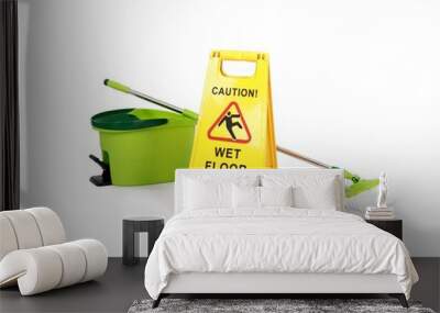 Yellow Caution slippery wet floor sign with mop and bucket in the background - Safety sign cleaning service - isolated on white background Wall mural