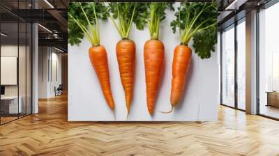 Four freshly harvested carrots arranged on a white background Wall mural