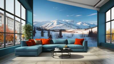 Vast snowy mountain landscape under a crisp, clear blue sky on a bright winter day Wall mural