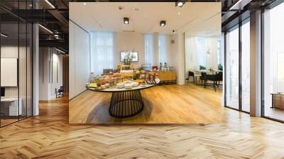 Breakfast served on round buffet table in hotel restaurant Wall mural