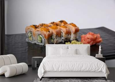 Salmon skin sushi roll served on a black stone Wall mural