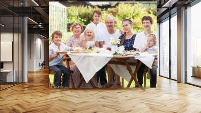 Most beautiful happy family in garden Wall mural