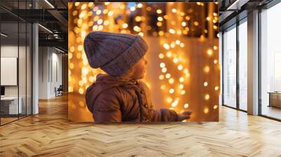 portrait of happy girl in winter evenings on background of Christmas lights Wall mural