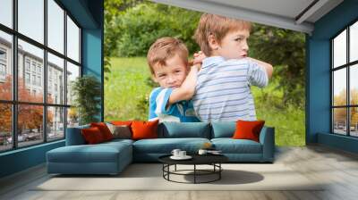 Two brothers are fighting. Wall mural